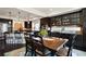 Stylish dining area with dark cabinetry, pendant lighting, and a table set for elegant meals at 3395 Starry Night Loop, Castle Rock, CO 80109