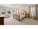 Bright and airy main bedroom featuring a decorative bed frame, soft carpets, and lots of natural light at 3395 Starry Night Loop, Castle Rock, CO 80109