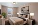 Comfortable main bedroom featuring a large bed, modern lamps, and a bright window at 3395 Starry Night Loop, Castle Rock, CO 80109