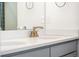 Bathroom features a white countertop and stylish brass faucet at 10512 Truckee St, Commerce City, CO 80022