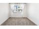 Bright bedroom featuring neutral carpet and natural light from two windows at 10512 Truckee St, Commerce City, CO 80022