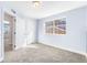 Bedroom with neutral carpet, natural light and modern white closet doors at 10512 Truckee St, Commerce City, CO 80022