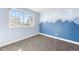 Bedroom with unique mountain wall design, large window for plenty of natural light at 10512 Truckee St, Commerce City, CO 80022