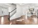 Image of a light and bright entryway with open floor plan with hardwood floors at 10512 Truckee St, Commerce City, CO 80022