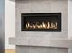 Modern fireplace with stylish gray tile surround in a cozy living space at 10512 Truckee St, Commerce City, CO 80022