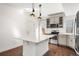 Well-equipped kitchen featuring a center island and stainless steel appliances at 10512 Truckee St, Commerce City, CO 80022