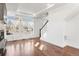 Bright living room featuring many windows and hardwood floors at 10512 Truckee St, Commerce City, CO 80022