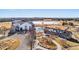 An inviting aerial view of a community park featuring playground, recreational facilities, and a unique building design at 10512 Truckee St, Commerce City, CO 80022