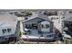 Back exterior featuring a patio with a fire pit, comfortable seating, garden beds, and a fenced yard at 7169 Canyon Sky Trl, Castle Pines, CO 80108
