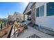 Patio with a fire pit, and comfortable seating surrounded by meticulous landscaping at 7169 Canyon Sky Trl, Castle Pines, CO 80108
