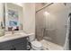 Modern bathroom boasts sleek gray tiling and a glass-enclosed shower at 7169 Canyon Sky Trl, Castle Pines, CO 80108