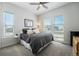 Comfortable bedroom with three bright windows and plush carpeting for a warm, inviting feel at 7169 Canyon Sky Trl, Castle Pines, CO 80108
