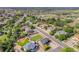 Aerial view of neighborhood showcasing a home with a well-maintained lawn and fenced backyard at 504 Branding Iron Ct, Brighton, CO 80601
