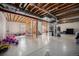 Unfinished basement offers potential with exposed ceiling, and bright, sealed concrete flooring at 504 Branding Iron Ct, Brighton, CO 80601