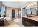 This bathroom features a soaking tub, large shower and dual sinks at 504 Branding Iron Ct, Brighton, CO 80601