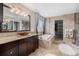 Bright bathroom features a soaking tub, walk-in shower and vessel sink at 504 Branding Iron Ct, Brighton, CO 80601