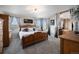 This main bedroom is complete with a decorative fireplace and an ensuite bathroom at 504 Branding Iron Ct, Brighton, CO 80601