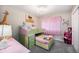 Adorable bedroom boasts bunk beds, princess decor, and pink accents for a whimsical touch at 504 Branding Iron Ct, Brighton, CO 80601