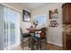 Breakfast nook with stylish seating, decor, sliding glass doors, and natural light at 504 Branding Iron Ct, Brighton, CO 80601