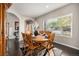 Formal dining room with hardwood floors, and large window offering abundant natural light at 504 Branding Iron Ct, Brighton, CO 80601
