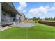 Enjoy this beautiful backyard with its manicured lawn, large patio, and surrounding fence at 690 Avena Dr, Elizabeth, CO 80107