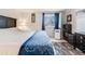 Bright bedroom featuring a king-size bed and ample closet space at 17361 E Mansfield Ave # 531R, Aurora, CO 80013