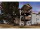 Rear view of building highlighting private deck and landscaping at 17361 E Mansfield Ave # 531R, Aurora, CO 80013