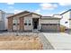 Charming single-Gathering home with brick accents, two-car garage, and a freshly landscaped front yard at 2548 Wesley Ln, Lafayette, CO 80026