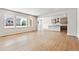 Bright open-concept living space with wood floors and large windows at 2548 Wesley Ln, Lafayette, CO 80026