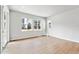 Bright living room features hardwood floors and multiple windows at 2548 Wesley Ln, Lafayette, CO 80026