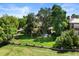 Picturesque aerial view of the property showcasing the large lot, lush landscaping, and inviting backyard at 4600 E 3Rd Ave, Denver, CO 80220