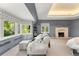 Bright bedroom featuring a fireplace, geometric curtains, and spacious layout at 4600 E 3Rd Ave, Denver, CO 80220