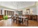 Elegant dining room with a large wooden table, ornate ceiling design, and beautiful wood floors at 4600 E 3Rd Ave, Denver, CO 80220