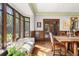 Bright dining room with intricate wood detailing, large windows, and classic features at 4600 E 3Rd Ave, Denver, CO 80220