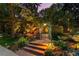 Beautifully landscaped entrance with stone steps and mature plants, offering a welcoming and serene atmosphere at 4600 E 3Rd Ave, Denver, CO 80220