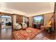 Stylish living room with a fireplace, large windows, and hardwood floors at 4600 E 3Rd Ave, Denver, CO 80220