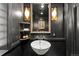 Chic powder room with dark walls, decorative lighting, and a vessel sink at 4600 E 3Rd Ave, Denver, CO 80220