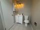 Bathroom with sink, toilet, medicine cabinet and tile flooring at 12478 W Nevada Pl # 207, Lakewood, CO 80228