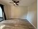 Spacious bedroom featuring neutral colors, modern fan, and a sliding door at 12478 W Nevada Pl # 207, Lakewood, CO 80228