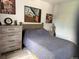 Cozy bedroom featuring a neutral color scheme, wood floors, and artwork for a sophisticated ambiance at 12478 W Nevada Pl # 207, Lakewood, CO 80228