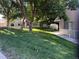 View of the exterior building with beautiful trees and a grassy lawn at 12478 W Nevada Pl # 207, Lakewood, CO 80228