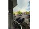 Exterior view from balcony with parking area, landscaping, and a picturesque rainbow at 12478 W Nevada Pl # 207, Lakewood, CO 80228