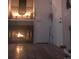 Cozy fireplace with decorative mantle, adjacent to a doorway at 12478 W Nevada Pl # 207, Lakewood, CO 80228