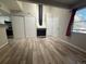 Living room with fireplace and access to the kitchen and an adjacent room at 12478 W Nevada Pl # 207, Lakewood, CO 80228