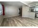 Open-concept living room with bar seating, and stainless steel appliances in kitchen at 12478 W Nevada Pl # 207, Lakewood, CO 80228