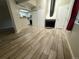 Spacious living room with fireplace, tile floors, and access to the kitchen at 12478 W Nevada Pl # 207, Lakewood, CO 80228