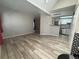 Open-concept living room with bar seating, and stainless steel appliances in kitchen at 12478 W Nevada Pl # 207, Lakewood, CO 80228