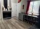 Living room featuring a fireplace, stylish cabinet, and wood-look tile flooring at 12478 W Nevada Pl # 207, Lakewood, CO 80228