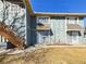 Two-story townhome featuring a private entrance and wood staircase leading to the second floor at 2269 Coronado Pkwy # C, Denver, CO 80229