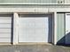 Garage door with white panels offering secure parking and easy access at 2269 Coronado Pkwy # C, Denver, CO 80229